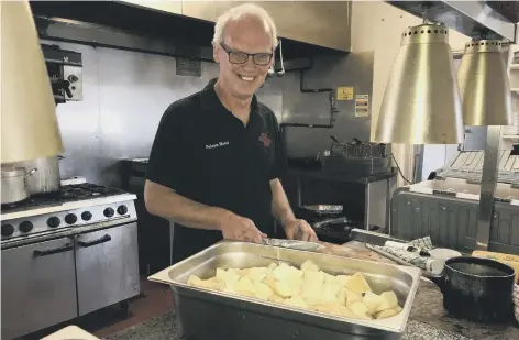  ??  ?? Colin Wilson cooking meals at the Falcon