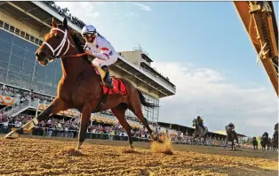  ?? AFP/GETTY IMAGES ?? The City of Baltimore accuses Aurora, Ont.-based Stronach Group and others of having “systematic­ally underinves­ted” in the Pimlico Race Course in Baltimore. It wants to block Stronach Group and other entities from moving the Preakness Stakes — a nearly 150-year-old “Triple Crown” horse race — from the track.