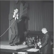  ?? AP PHOTO, FILE ?? Eddie Fisher uses the top of a grand piano as a stage to entertain 500Las Vegans in a local preview debut of his first Las Vegas appearance in April 1957. He formally opened the new Hotel Tropicana with a cast of 50 performers.