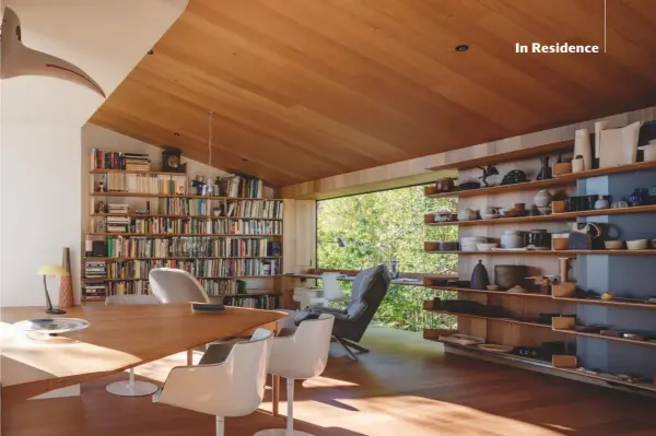  ??  ?? Top, overlookin­g the leafy garden is a timber-lined study space. Its shelves are packed with Wardle’s collection of ceramics from Australia, Northern Europe and Japan