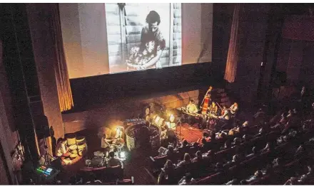  ?? — AFP ?? Captivatin­g scene: Audience viewing ‘Mya Ga Naing’ or The Emerald Jungle – Myanmar’s oldest film still in existence made in 1934 by director Maung Tin Maung – during the opening ceremony of the Memory Internatio­nal Film Heritage Festival in Yangon.