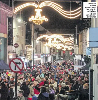  ?? ?? The festive scene on O’Connell Street last Saturday as the lights overhead were officially switched on.