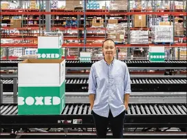  ?? JEENAH MOON PHOTOS / THE NEW YORK TIMES ?? Chieh Huang is CEO of Boxed, whose warehouse is in Union, N.J. Boxed has sold a minority stake to Aeon Group, one of the largest retail chains in Japan. The deal values the startup at $600M, according to a person familiar with it.