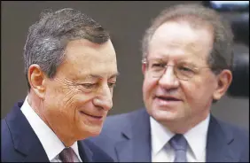  ?? Ap photo ?? President of the European Central Bank Mario Draghi, left, and vice-president Vitor Constancio go to a news conference in Frankfurt, Germany.