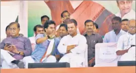  ?? HT PHOTO ?? Congress president Rahul Gandhi with Madhya Pradesh campaign committee head Jyotiradit­ya Scindia during a public meeting in Jaura in Morena district on Tuesday.