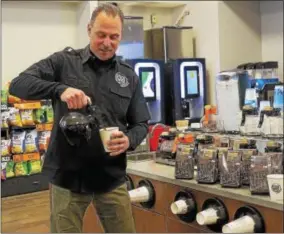  ?? PHOTO BY ANDREWAURI­GEMA ONEIDA DISPATCH ?? Utica Coffee Roasting Company owner Frank Elias pours a cup of coffee.