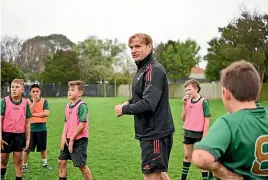  ?? ?? Crusaders head coach Scott Robertson takes a training session at Bromley school in Christchur­ch.