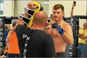  ?? BRITTANY CHAY - THE NEWS-HERALD ?? Stipe Miocic works out July 23 at Strong Style MMA and Fitness Center in Strongsvil­le.