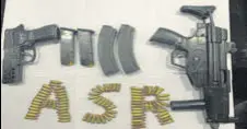  ?? HT PHOTO ?? A German-made MP5 sub-machine gun and a 9-mm pistol were among arms seized from the two men in Amritsar.