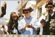  ?? ?? Milford Mayor Ben Blake, center, stands with others at Lisman Landing during the 2021 Pirates Day.