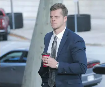  ??  ?? Former Windsor Spitfire Ben Johnson walks towards Superior Court for his sentencing hearing on Monday. Johnson, 22, who was convicted last month of rape, will be sentenced by Justice Kirk Munroe on Tuesday.