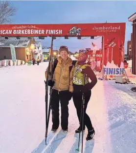  ?? COURTESY OF AMBER GLAWE ?? After the 2023 women’s classic race of the American Birkebeine­r, Amber Glawe, right, smiles with her friend, Erica Schwanke. Glawe was the last-place finisher, but, she said, “it was a really cool experience.”