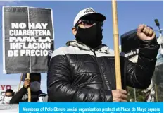  ?? —AFP ?? Members of Polo Obrero social organizati­on protest at Plaza de Mayo square holding banners mostly against the hunger, layoff, external debt, or lack of water in slums during the May Day in Buenos Aires in this file photo.