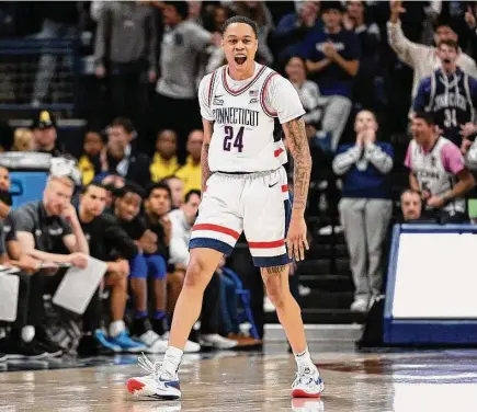  ?? Jessica Hill/Associated Press ?? UConn’s Jordan Hawkins reacts after making a 3-point basket in the second half against Seton Hall on Feb. 18 in Storrs.