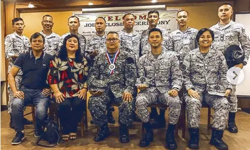  ??  ?? Accompanie­d by his parents, Rocco (second from right) with his fellow navy reservists after his oath-taking as Petty Officer (PO) 3rd Class with the Philippine Navy