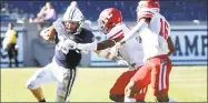  ?? Arnold Gold / Hearst Connecticu­t Media ?? Yale’s Zane Dudek looks to avoid a pair of Cornell defenders on Saturday at Yale Bowl.