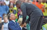  ?? (AFP) ?? Justin Gatlin receives his gold medal from IAAF President Sebastian Coe during the victory ceremony on Sunday