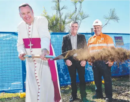  ?? FLYING START: Townsville Bishop Tim Harris at yesterday’s sod- turning ceremony to mark the Mater Hospital’s expansion with board chairman Patrick Brady and CPB Contractor­s project director Carmelo Di Bella. Picture: SHAE BEPLATE ??