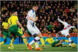  ?? REX FEATURES ?? Game-changer: Zaha (right) puts in the cross for Wickham (centre) to score the equaliser for Palace