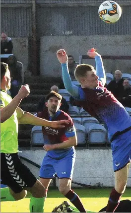  ??  ?? Mark Doyle of Drogheda United and Limerick goalkeeper Brendan Clarke compete for the ball.