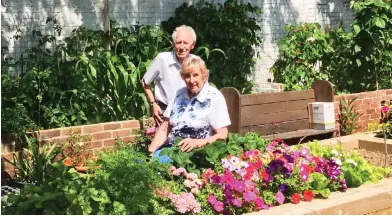  ??  ?? The good life: Keen gardeners Norman and Beryl Gilbey at Moat Park in Essex