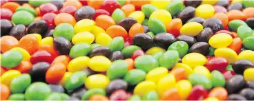  ?? OTTO GREULE JR. / GETTY IMAGES ?? Skittles co-funded studies claiming that children who eat candy are less overweight.