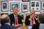  ?? HIROKO MASUIKE — THE NEW YORK TIMES (VIA AP) ?? With New York Times Publisher Arthur Sulzberger Jr. seated next to him, President-elect Donald Trump, left, meets with Times reporters and editors on Tuesday at the newspaper’s main office in Manhattan.