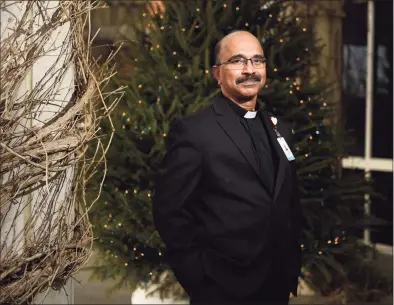  ?? Tyler Sizemore / Hearst Connecticu­t Media ?? Greenwich Hospital Chaplain the Rev. Chris Johnson in the courtyard outside Greenwich Hospital in Greenwich on Dec. 8.