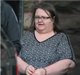  ?? CP PHOTO ?? Elizabeth Wettlaufer is escorted by police from the courthouse in Woodstock, Ont. on Monday.