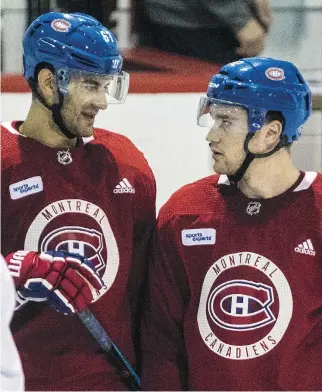  ?? DAVE SIDAWAY ?? Canadiens captain Max Pacioretty, left, chats with new teammate Jonathan Drouin during a practice last month at the Bell Sports Complex in Brossard. Drouin is often among the last players off the ice at practice.