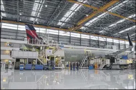  ?? CONTRIBUTE­D ?? At the Airbus facility in Mobile, Ala., workers assemble commercial jets for Delta Air Lines and other carriers.