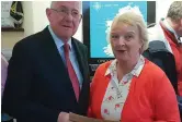  ??  ?? Mary Carway hands a letter of protest about Post Office closures to Minister Charlie Flanagan.