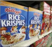  ?? THE ASSOCIATED PRESS FILE PHOTO ?? Kellogg’s cereals are on display at a Pittsburgh grocery market. Kellogg is closing distributi­on centers around the nation, laying off more than 1,000 workers.