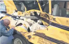  ??  ?? A damaged school bus is seen at the scene of a pickup truck attack.