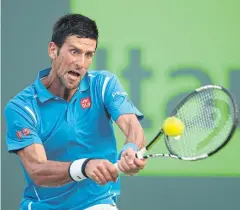  ?? AFP ?? Novak Djokovic returns a shot to Joao Sousa during their Miami Open match.