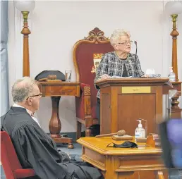  ?? STU NEATBY • THE GUARDIAN ?? Lt.-Gov. Antoinette Perry reads the 2021 speech from the throne before the P.E.I. legislatur­e. Seated at left is Speaker Colin LaVie.