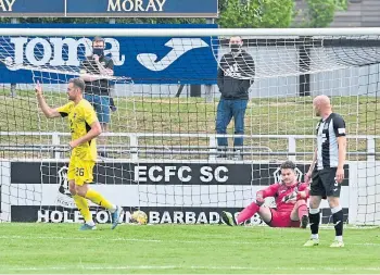  ??  ?? Ross County striker Jordan White celebrates after netting in the Borough Briggs game.