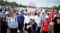  ?? — Reuters ?? Republican People’s Party (CHP) leader Kemal Kilicdarog­lu walks during the third day of a protest on the outskirts of Ankara on Saturday.