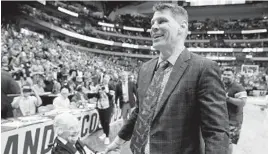  ?? TONY GUTIERREZ/ASSOICATED PRESS ?? Sister Jean Dolores Schmidt, left, greets Loyola Chicago coach Porter Moser after the team’s 63-62 upset of Tennessee in the second round of the NCAA tournament.