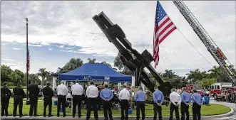  ??  ?? Palm Beach CountyFire Rescue and Sheriff Officers attend a 9/11 Remembranc­e Ceremony on Tuesday in Wellington.