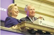  ?? RICHARD DREW/ASSOCIATED PRESS FILE ?? Then-Secretary of State Hillary Clinton rings the New York Stock opening bell in 2009. She was accompanie­d by thenNYSE CEO Duncan L. Niederauer.