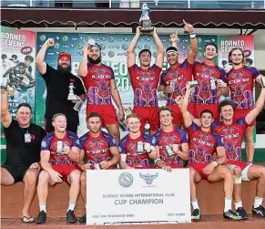  ??  ?? Giant killers: ICONZ players celebratin­g their victory after defeating defending champions Borneo Eagles in the Borneo Sevens in Sandakan yes-