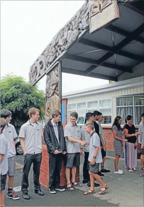  ?? Photos: ABBY BROWN ?? BOYS TO MEN: Matamata College year 13s welcome the year 9s to school on their first day.