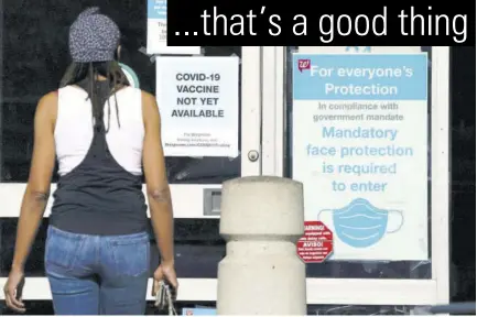  ?? (Photo: AP) ?? A customer walks past a sign indicating that a COVID-19 vaccine is not yet available at Walgreens on December 2, 2020, in Long Beach, California.