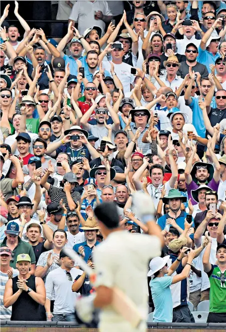  ??  ?? Glory moment: Fans applaud Alastair Cook as he reaches 200 and (left) Stuart Broad plays a pull shot