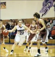  ?? KRISTI RIEKEN — THE ASSOCIATED PRESS ?? In this Friday photo, Dawson’Äôs Murissa Horton (22) dribbles through several Sands defenders during a high school basketball game in Welch, Texas. At the smallest high school in Texas, injuries and dwindling enrollment forced the Dawson Dragons to...