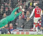  ?? REUTERS ?? Danny Welbeck (right) scored a double in Arsenal’s 31 win over AC Milan in the second leg of their round of 16 match.