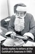  ??  ?? Santa replies to letters at the Guildhall in Swansea in 1985