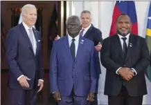  ?? AP file photo ?? President Joe Biden poses for photos with Pacific Island leaders including Solomon Islands Prime Minister Manasseh Sogavare (center) and Papua New Guinea Prime Minister James Marape at the White House in Washington, on Sept. 29.