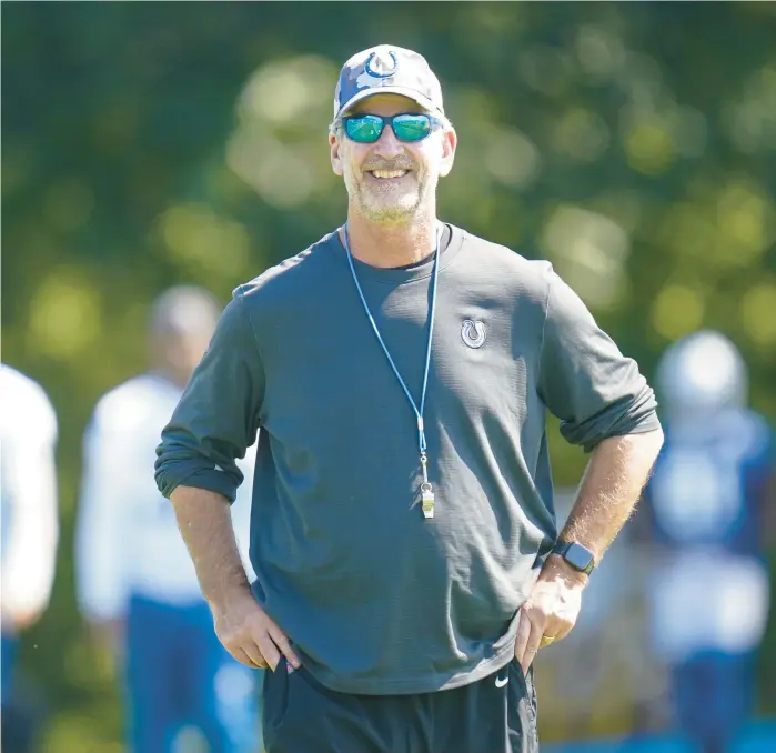  ?? MICHAEL CONROY/AP ?? Colts head coach Frank Reich walks out to practice Aug. 24 at the team’s training camp in Westfield, Indiana.